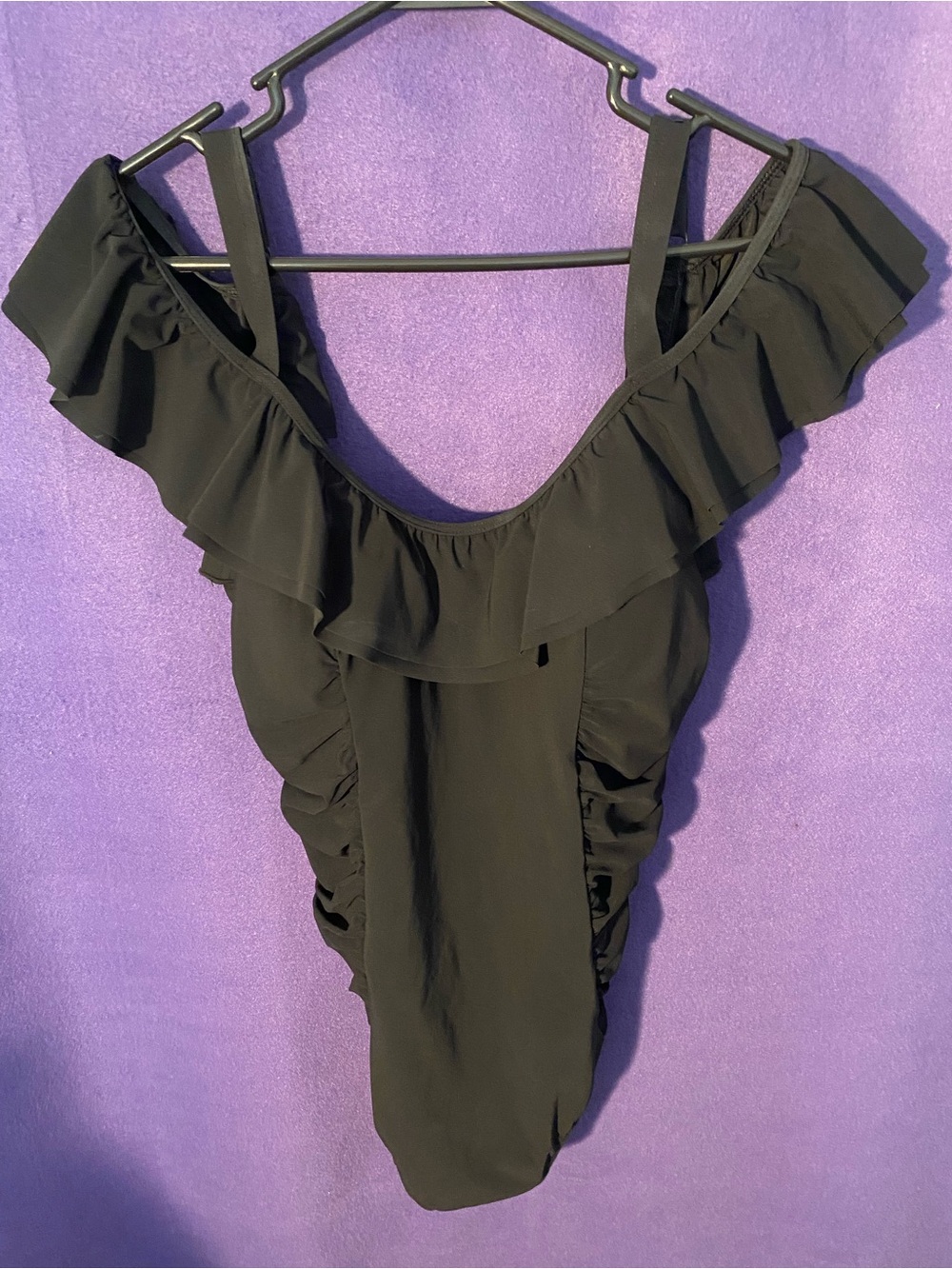 Unique bathing suit can be worn on or off shoulder. Size 16 but fits like a 14.